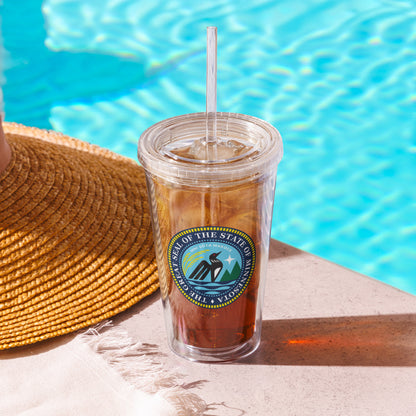 Minnesota State Seal on a clear tumbler with a straw by a pool