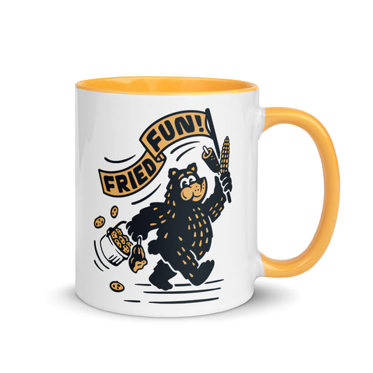 Fair Bear "Fried Fun!" ceramic mug with colorful yellow interior — 11 oz Minnesota fair graphic coffee mug, right view.