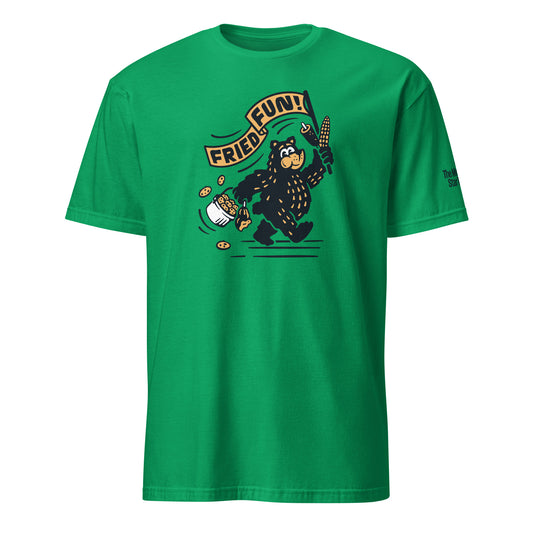 Front view of green soft style tshirt with Fair Bear "Fried Fun!" graphic. Design includes cartoon bear with cookies, corn dog, and roasted corn. 